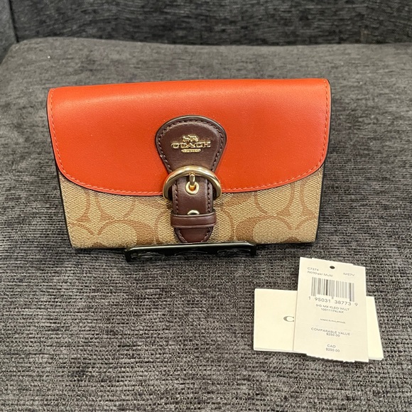 Coach Handbags - NWT Signature Mix Coach Tan and Rust Kleo Wallet